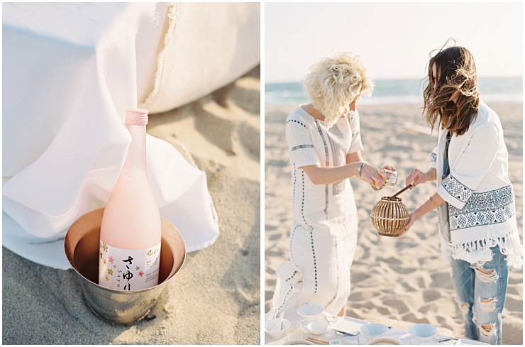 Two women pouring sake on Silver Strand beach in Ventura County photos