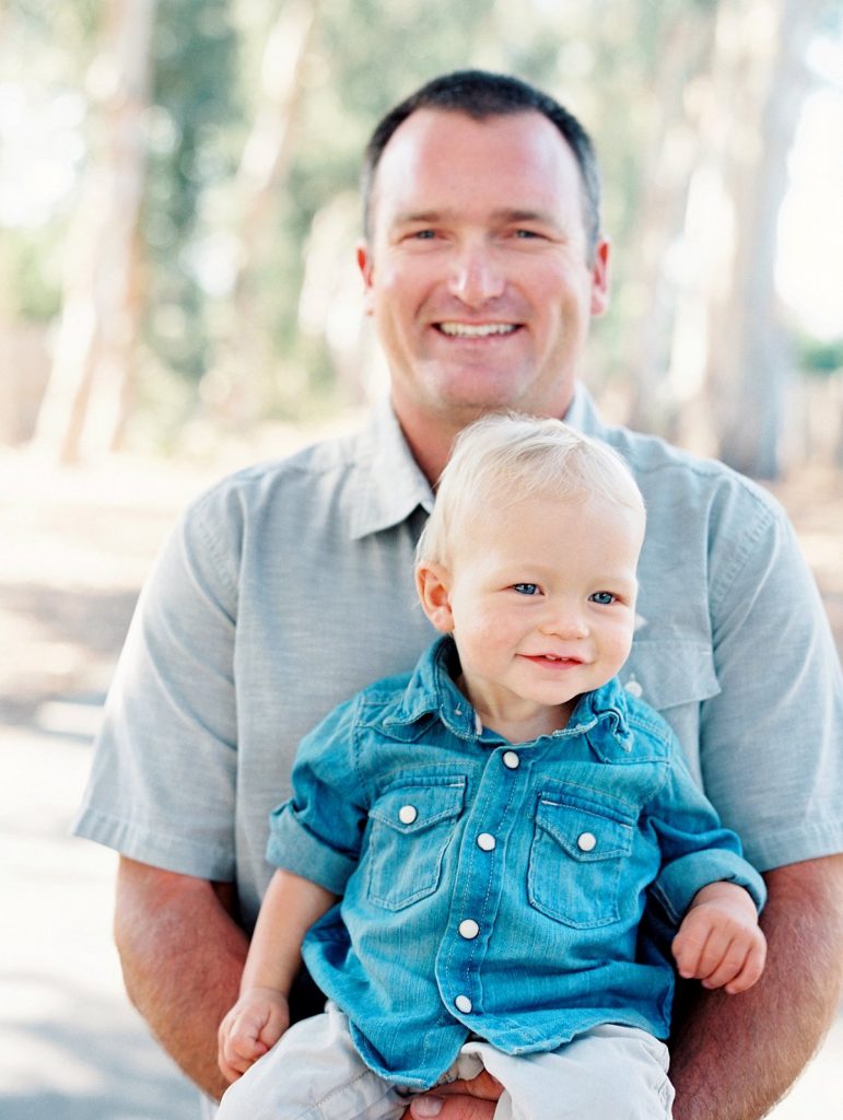 A dad and his baby boy smile at the camera in Camarillo, California