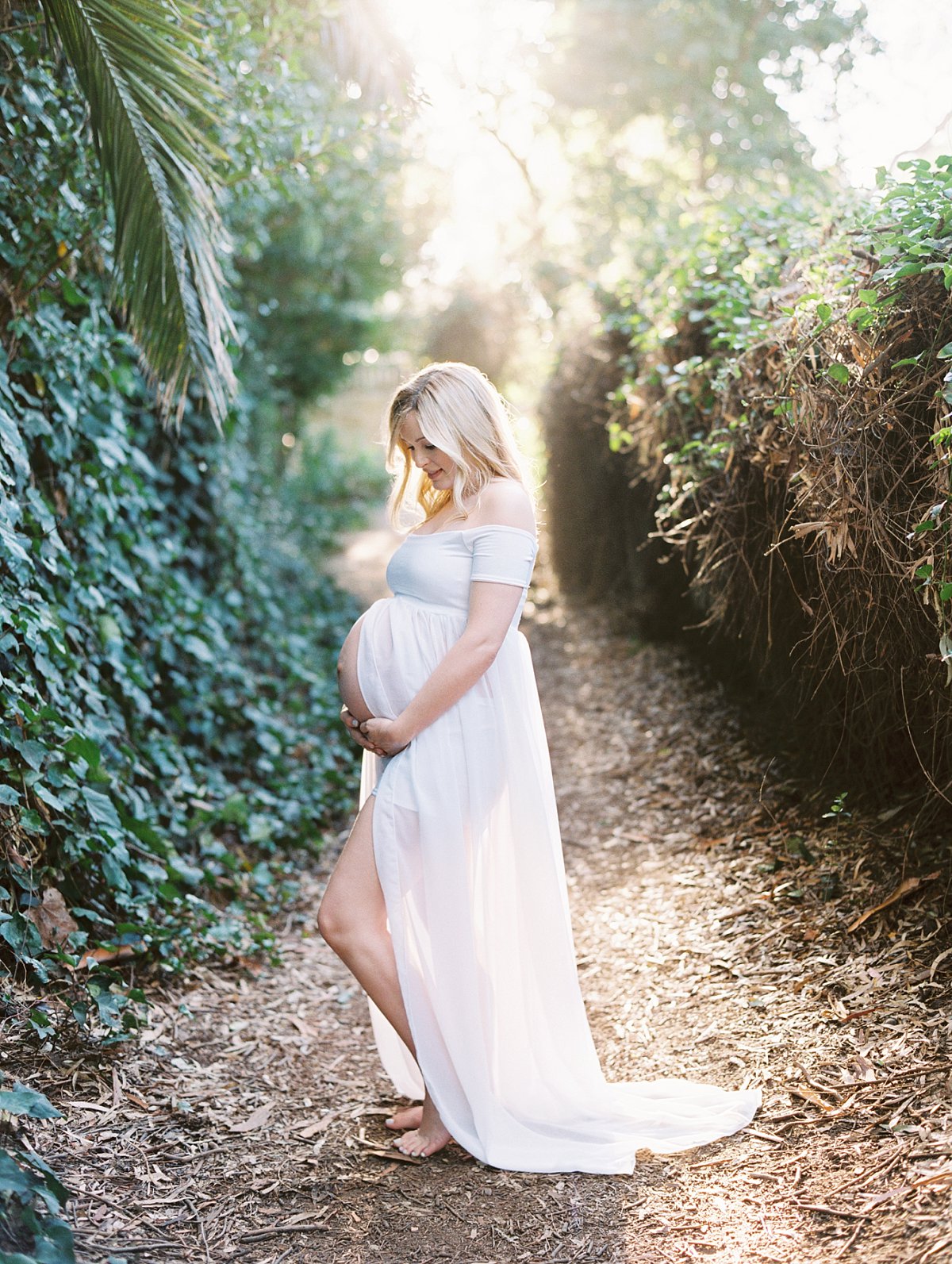 Santa Barbara Maternity Photographer Daniele Rose captures a mother to be in a white dress