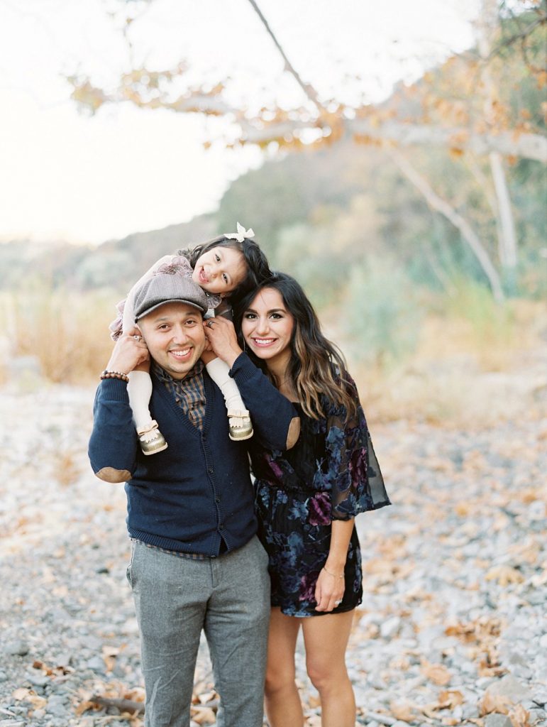 Thousand Oaks Child Photographer Daniele Rose captures an image of a family smiling at the camera at Peter Strauss Ranch 