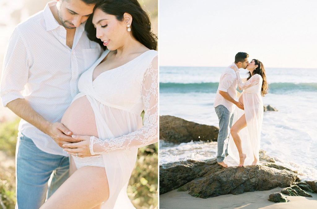A couple kisses on the beach during their Malibu maternity session with photographer Daniele Rose.
