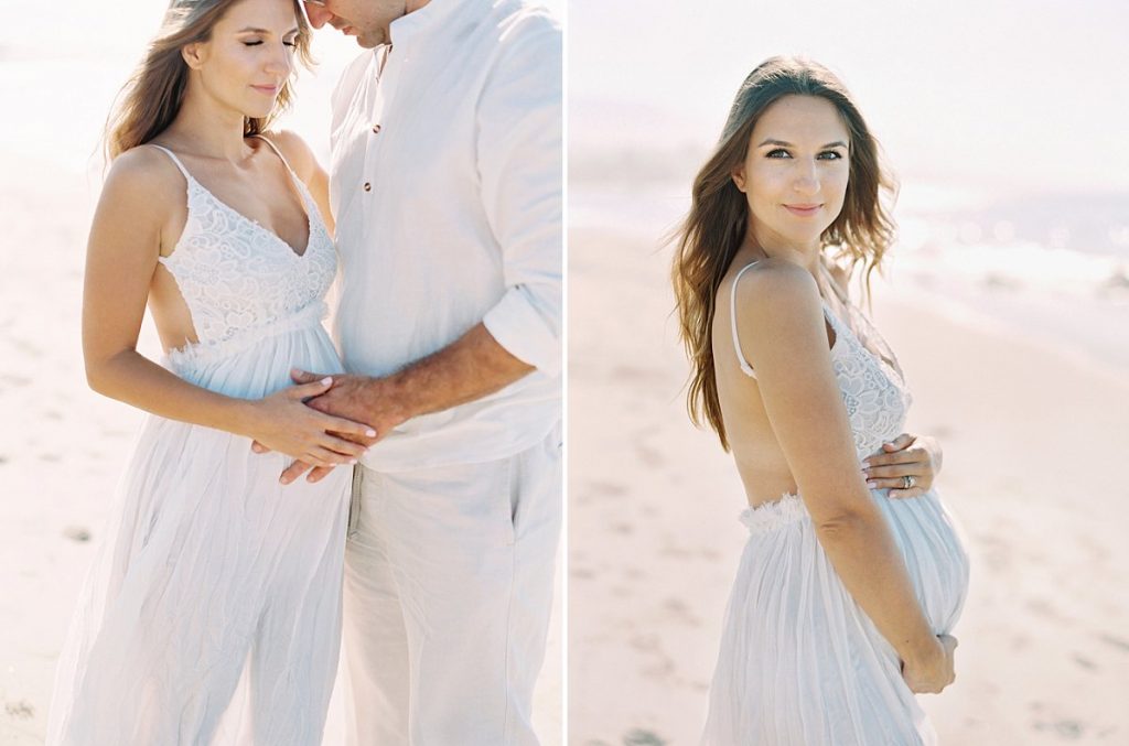 A couple hugs on the beach in Santa Barbara during their maternity session with photographer Daniele Rose.