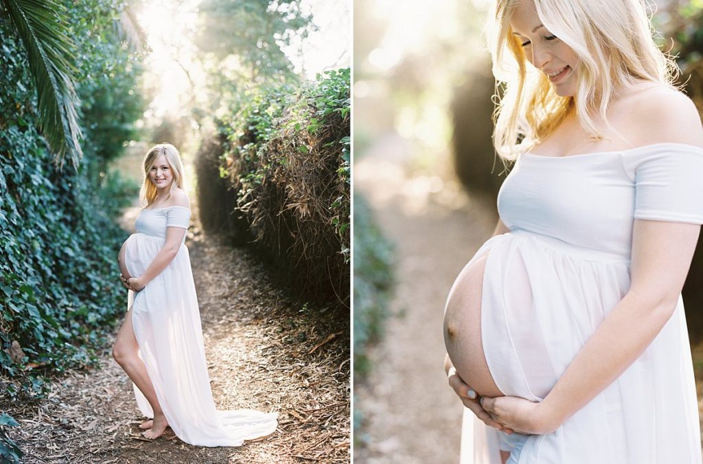 A pregnant woman in a white dress poses in Santa Barbara during her maternity session post about what to wear for a maternity photo session.