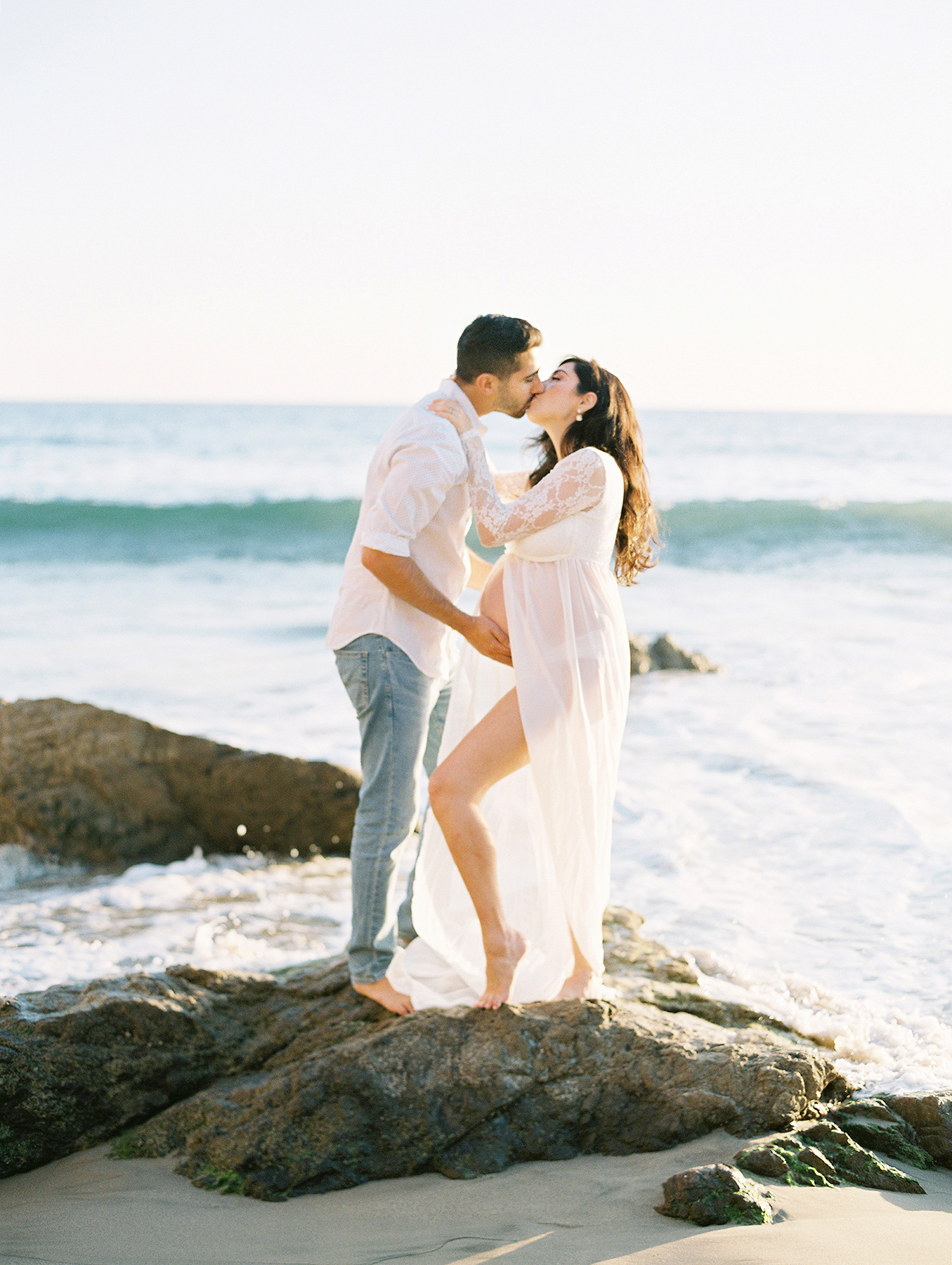 Couple kissing at El Matador beach in Malibu