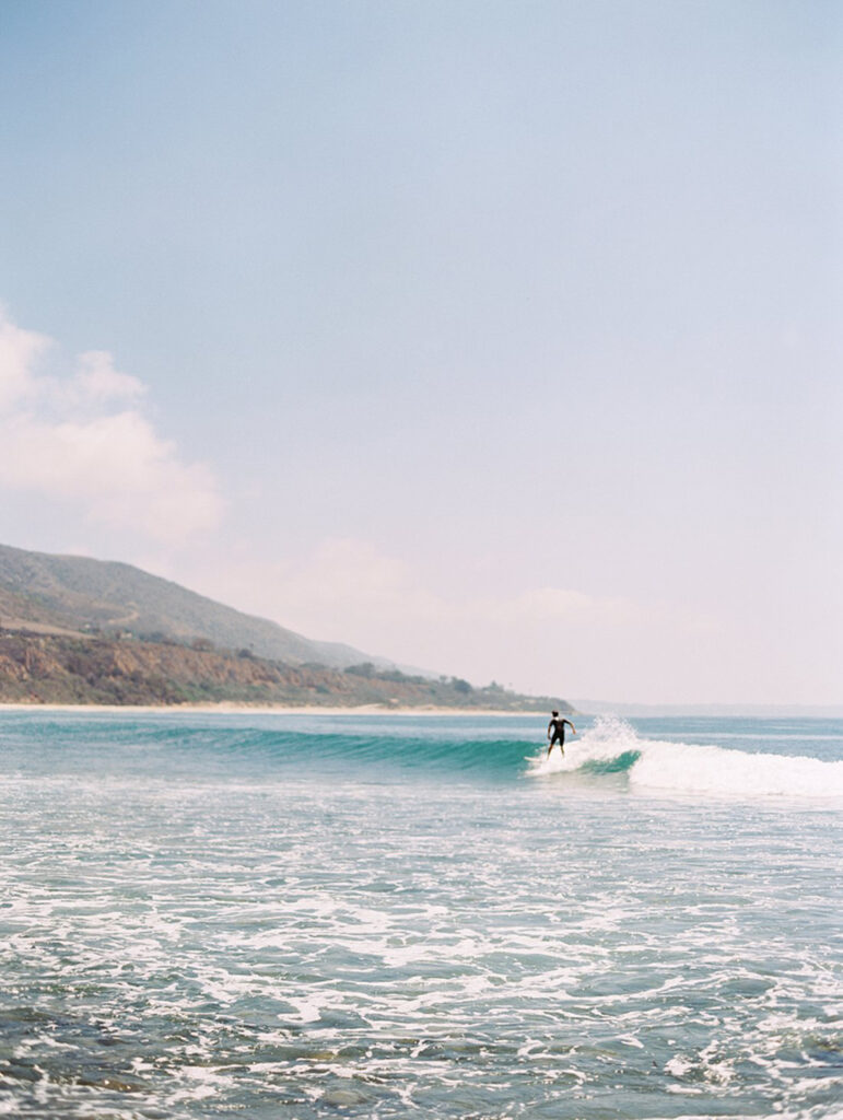 Photo of a surfer at Leo Carrillo beach in Malibu, California