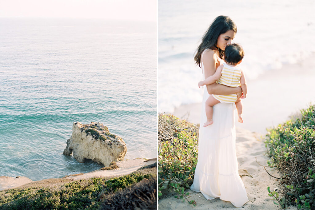A mother kisses her baby on the head while standing on the bluffs overlooking the ocean at El Matador Beach in Malibu.