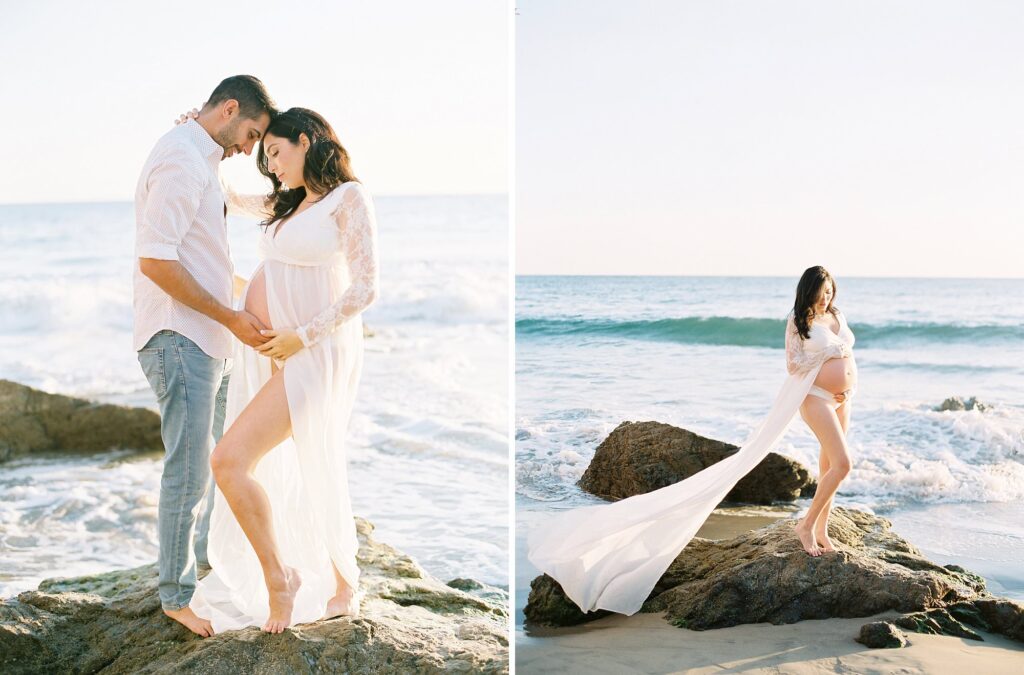 Maternity portrait of a couple wearing white standing on the rocks at El Matador Beach by Malibu photographer Daniele Rose