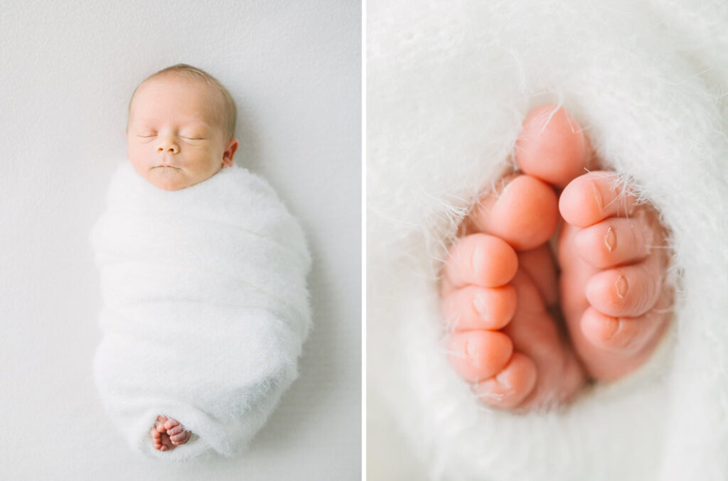 A baby wrapped in a white swaddle sleeping during a studio newborn photography session.