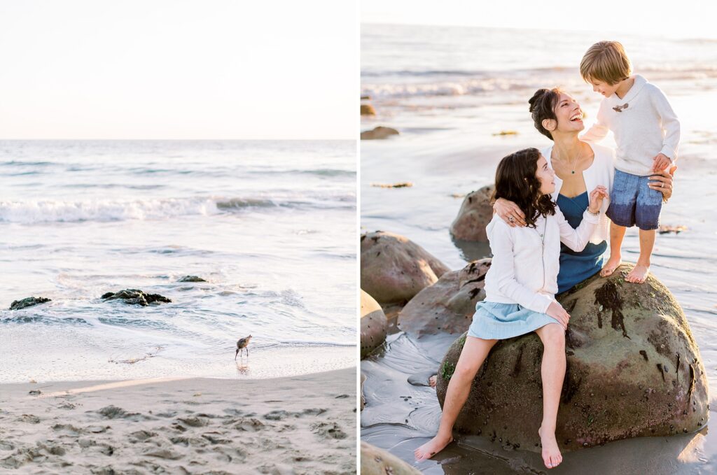 Mother and children in matching cream summer family photo outfits sitting on beach rocks