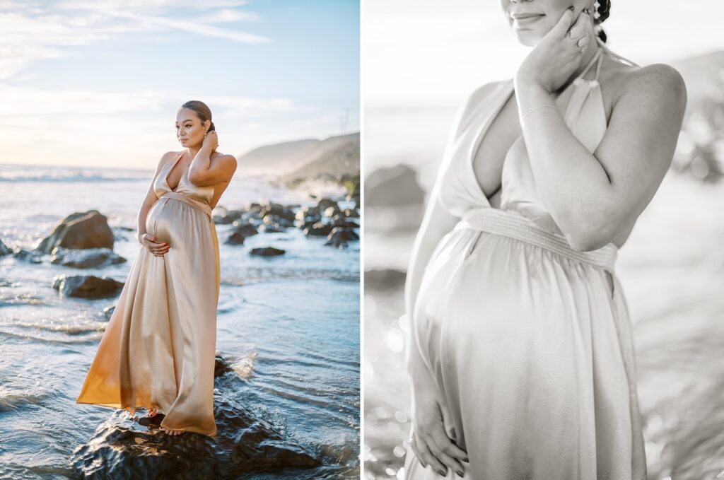 A mom to be in a gold gown standing on rocks on the beach during her session with Malibu maternity photographer Daniele Rose