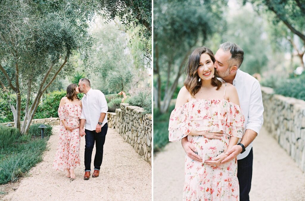 When to take maternity photos of an expecting couple walking together through a garden